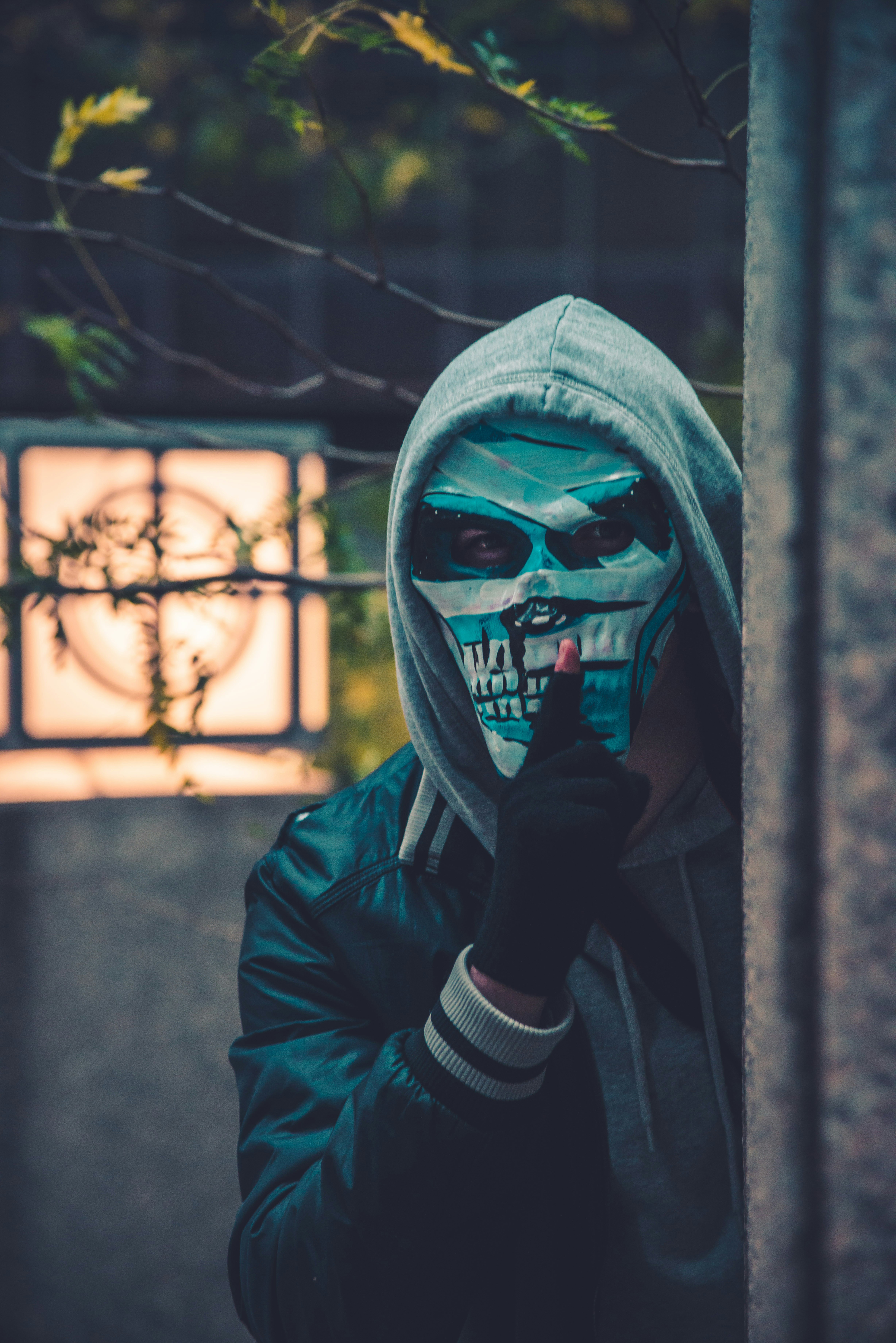 photo of person wearing mask near barbed wire